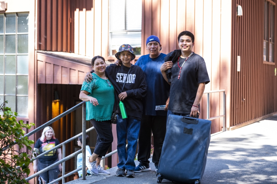 A photo of a family and their student during move-in at Cal Poly Humboldt